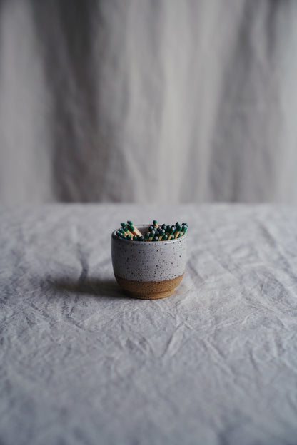 white speckled match holder