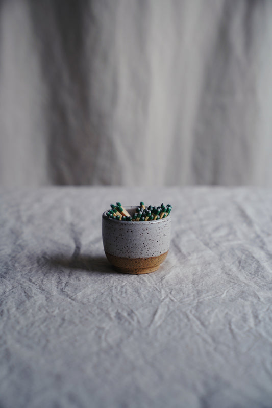 white speckled match holder