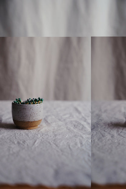 white speckled match holder