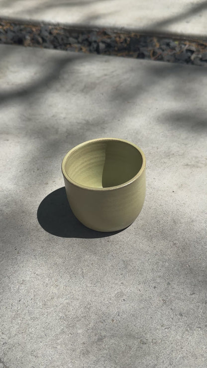 green ceramic tumbler